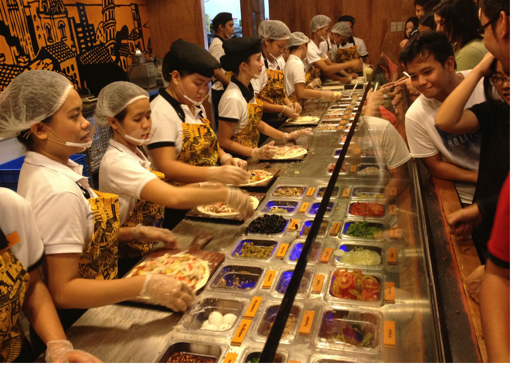 Pizza Republic Cebu Pick + Mix counter features rows of toppings.