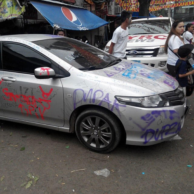One of the cars trashed during the Sinulog. (Photo by Mike Limpag)