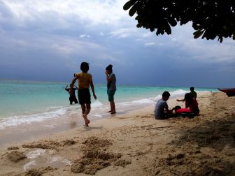 Kids at play on Lambug Beach in Badian