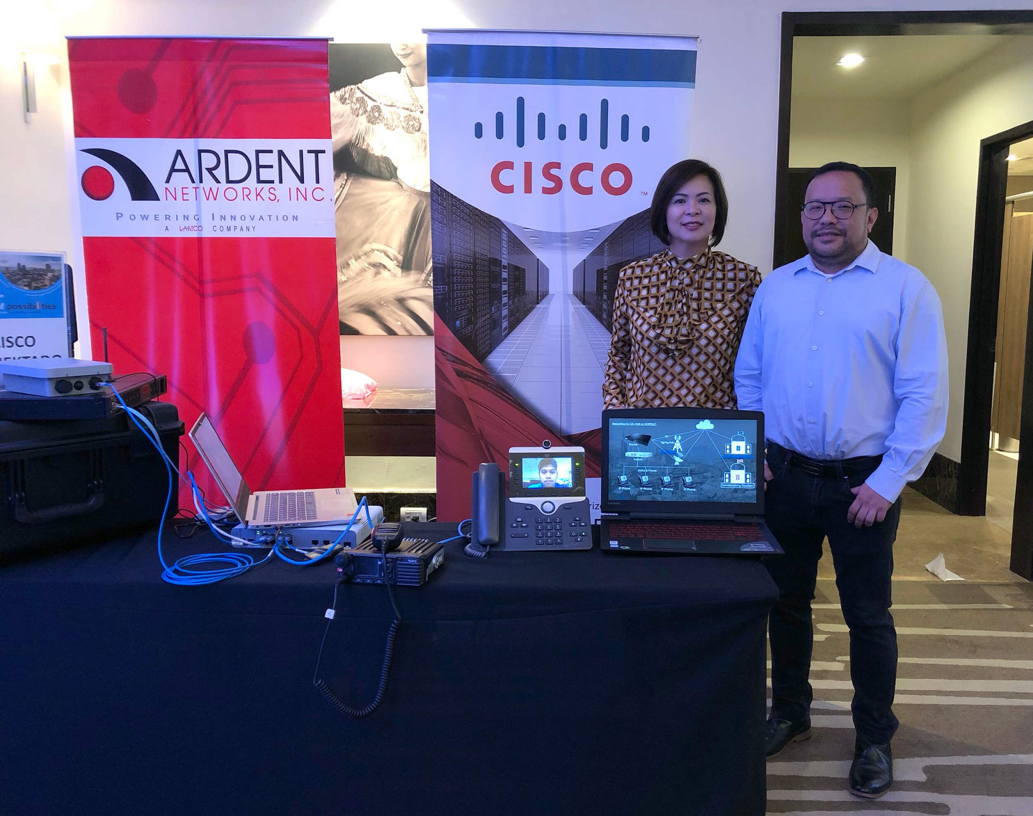 NETWORK IN A BOX. Cisco Philippines Managing Director Karrie Ilagan and Partner Account Manager for Sales Bong Rollan with the Cisco KONEKTADO solution that helps local government and responders prepare for and deal with disasters.