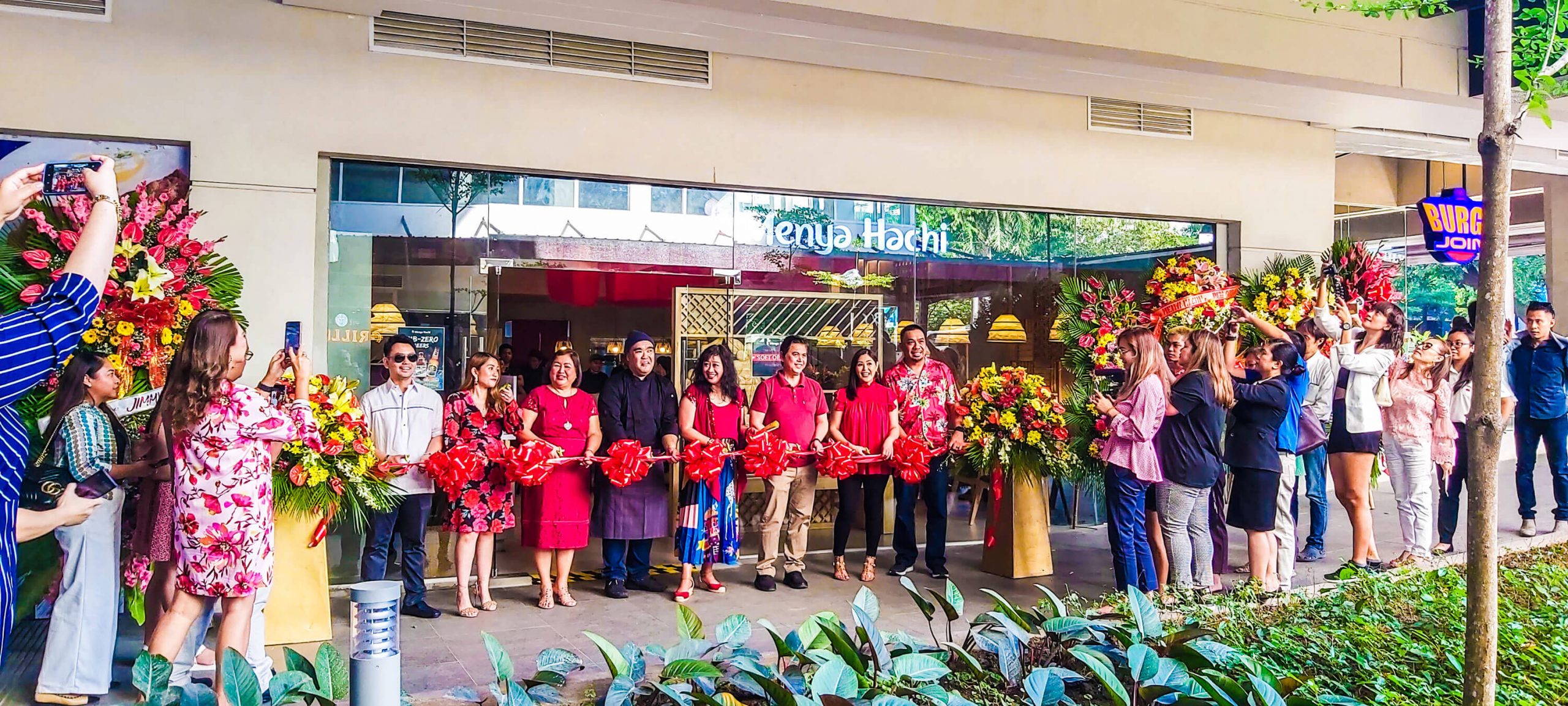 OPENING. Menya Hachi owners, officials, employees, and guests cut the ribbon to open the restaurant located in Ayala Malls Central Bloc in the IT Park.