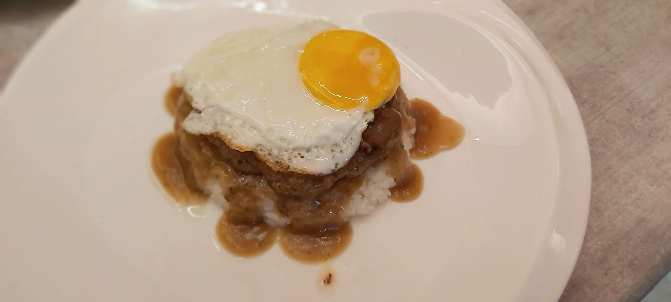 LOCO MOCO. This is Hawaiian-style burger steak served on a bed of Japanese white rice with brown gravy and egg.