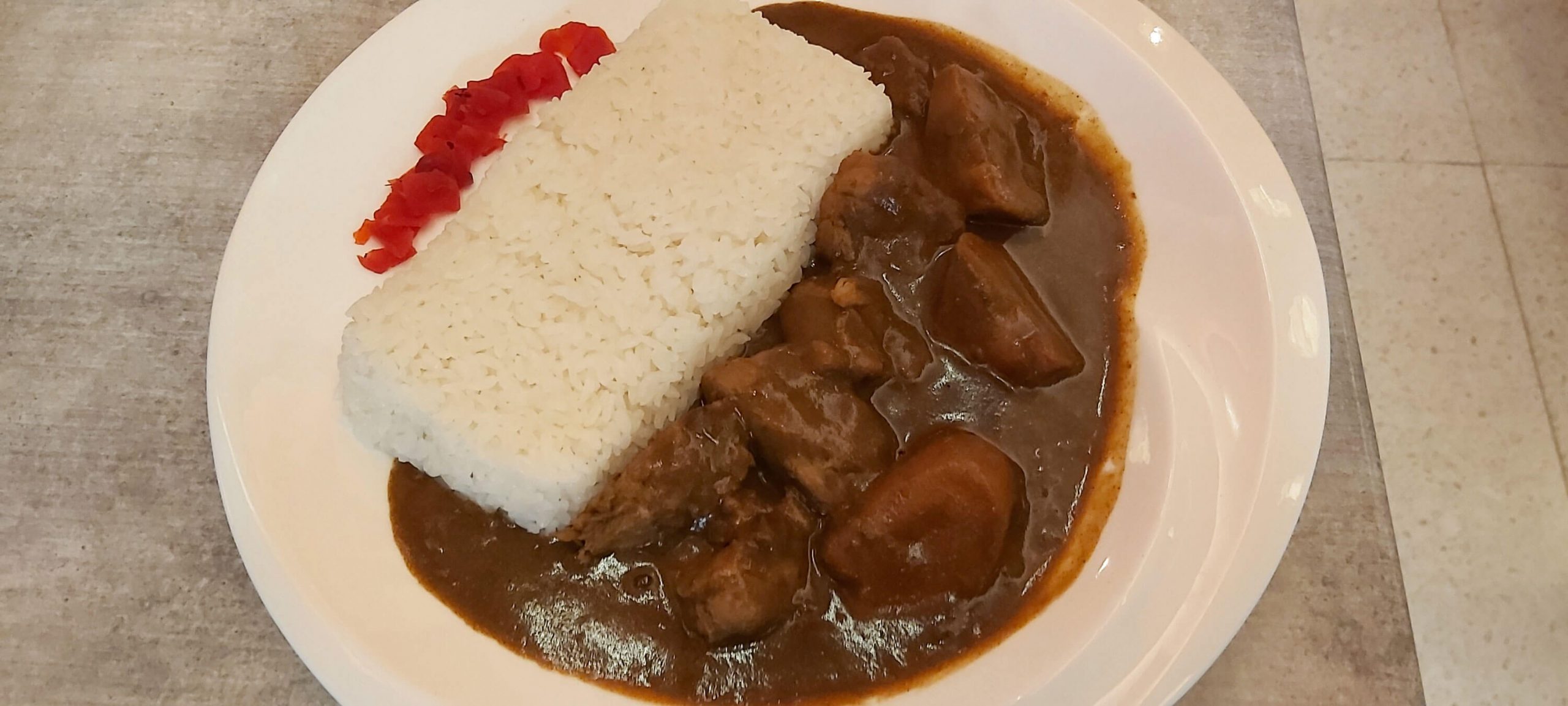 PORK CURRY. Japanese-style curry with slow-braised, tender pork and carrots served with Japanese white rice.