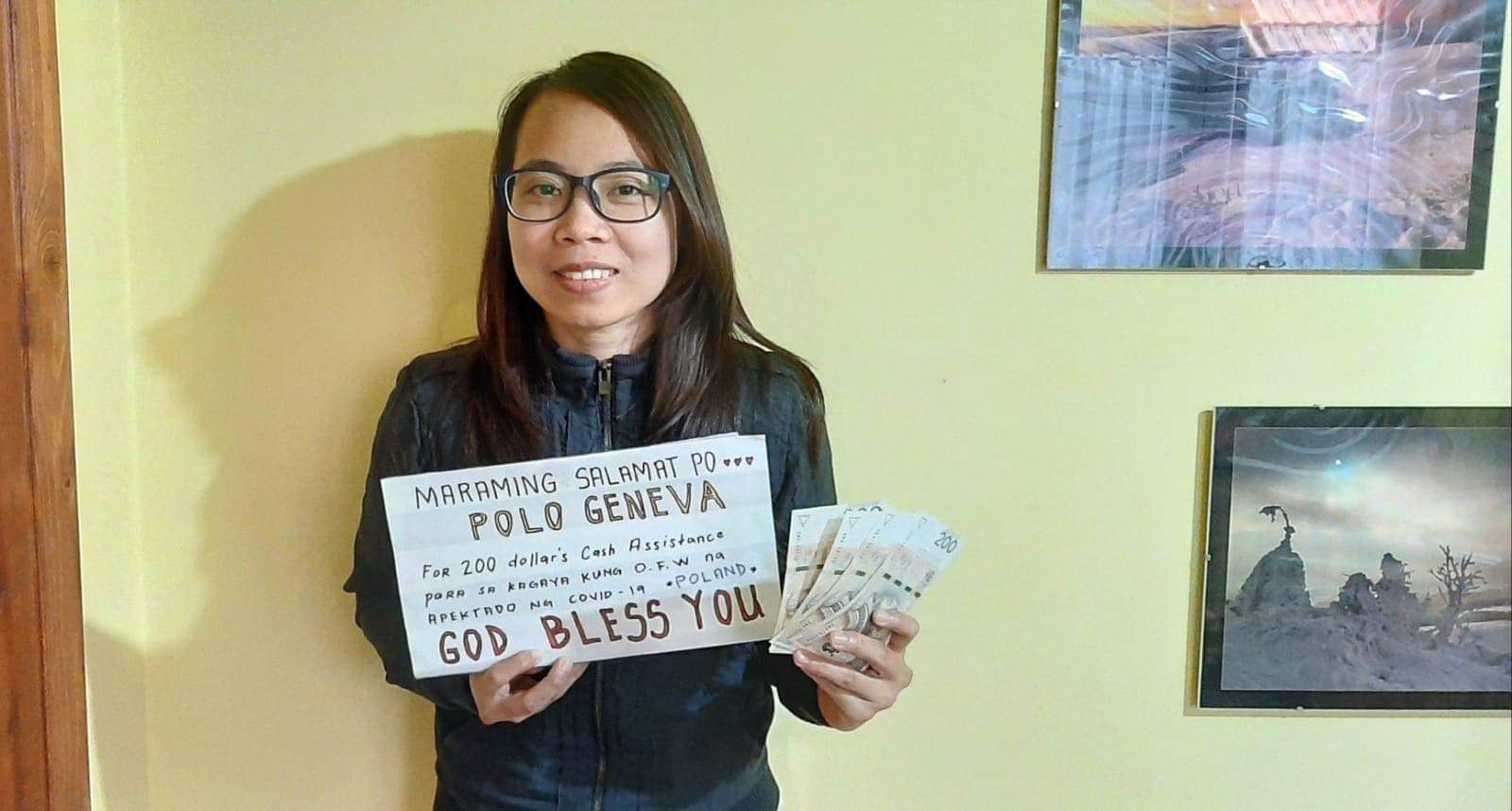 CASH ASSITANCE. An overseas worker shows the cash assistance she received from the Philippine government. (Photo from the Department of Labor and Employment Facebook page.)