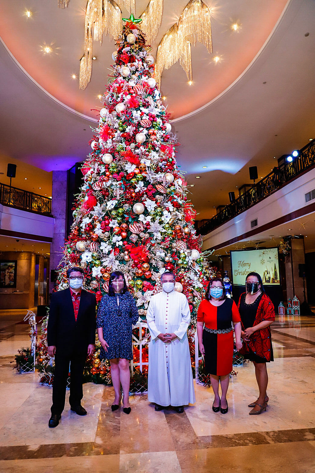 TREE OF HOPE. At the Tree of Hope in the hotel lobby are (from left) Jude Pangan, Jude Pangan, Ann Marie Tan, Msgr. Jim Gorre, Lara Scarrow, and Amabelle Russiana.
