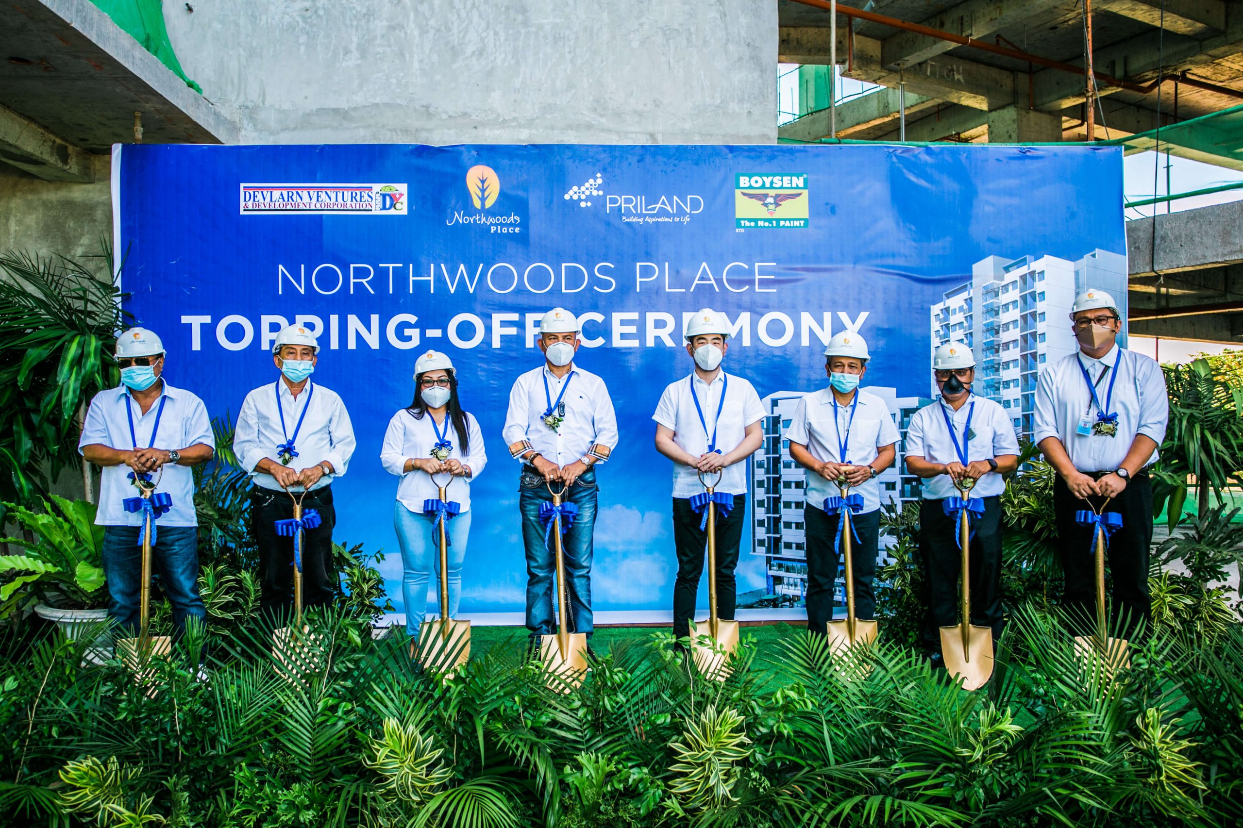 TOPPING OFF. Joining the ceremony are (from left) Reynaldo Eugenio, VP for Operations, Devlarn Ventures and Development Corporation; Eduardo Bagcat, COO; Nathalie Vargas, VP Admin and Finance; Deryl Vargas, CEO and President; Ramon Carlo Yap, President, Priland Development Corporation; Marcelino Relampagos, COO; Roy Vincent Lumayag, VP for Technical; and Dudes Tuanquin, VP for Sales and Marketing.