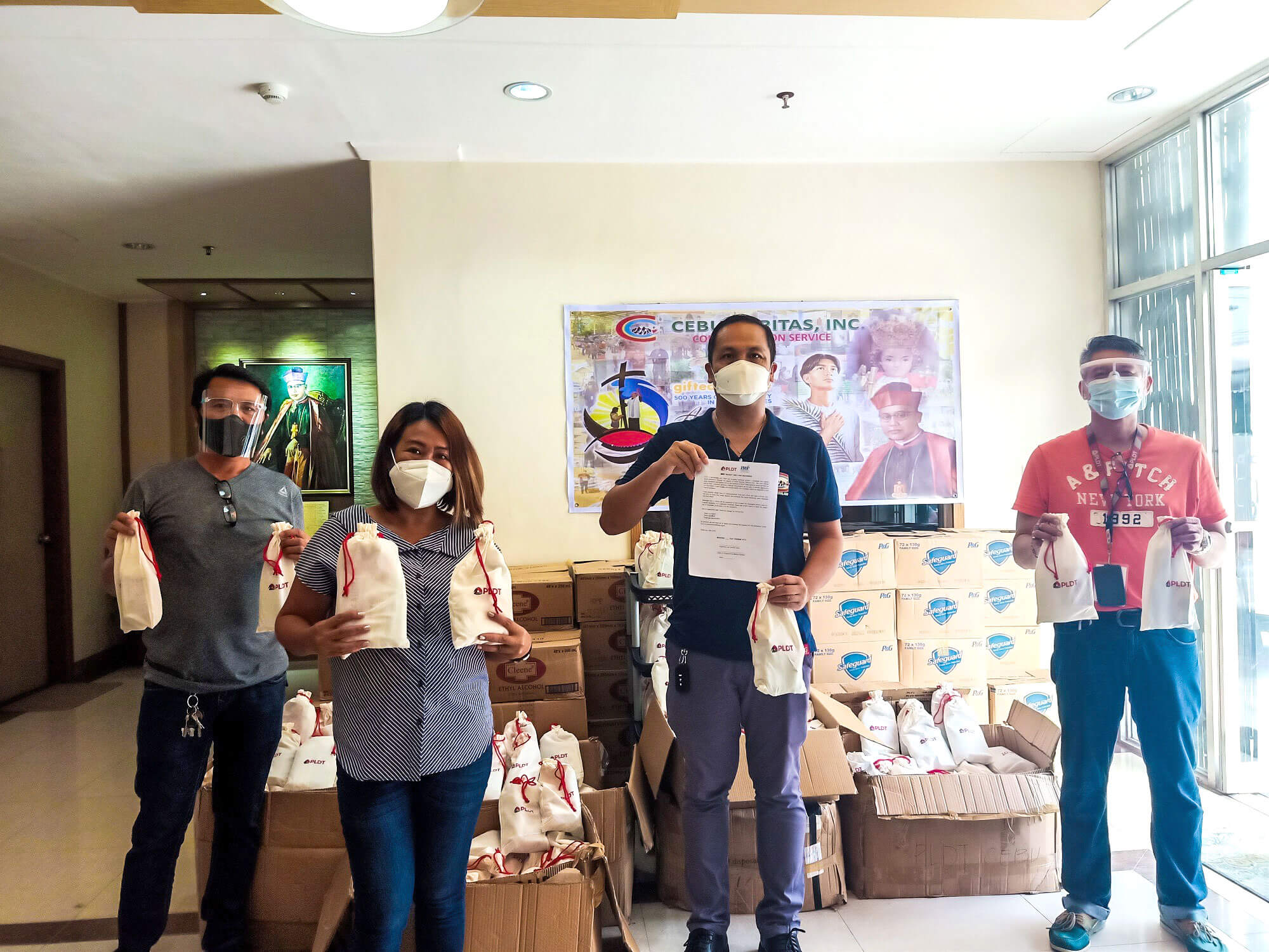 PLDT Cebu turns over the hygiene kits to Caritas Cebu.