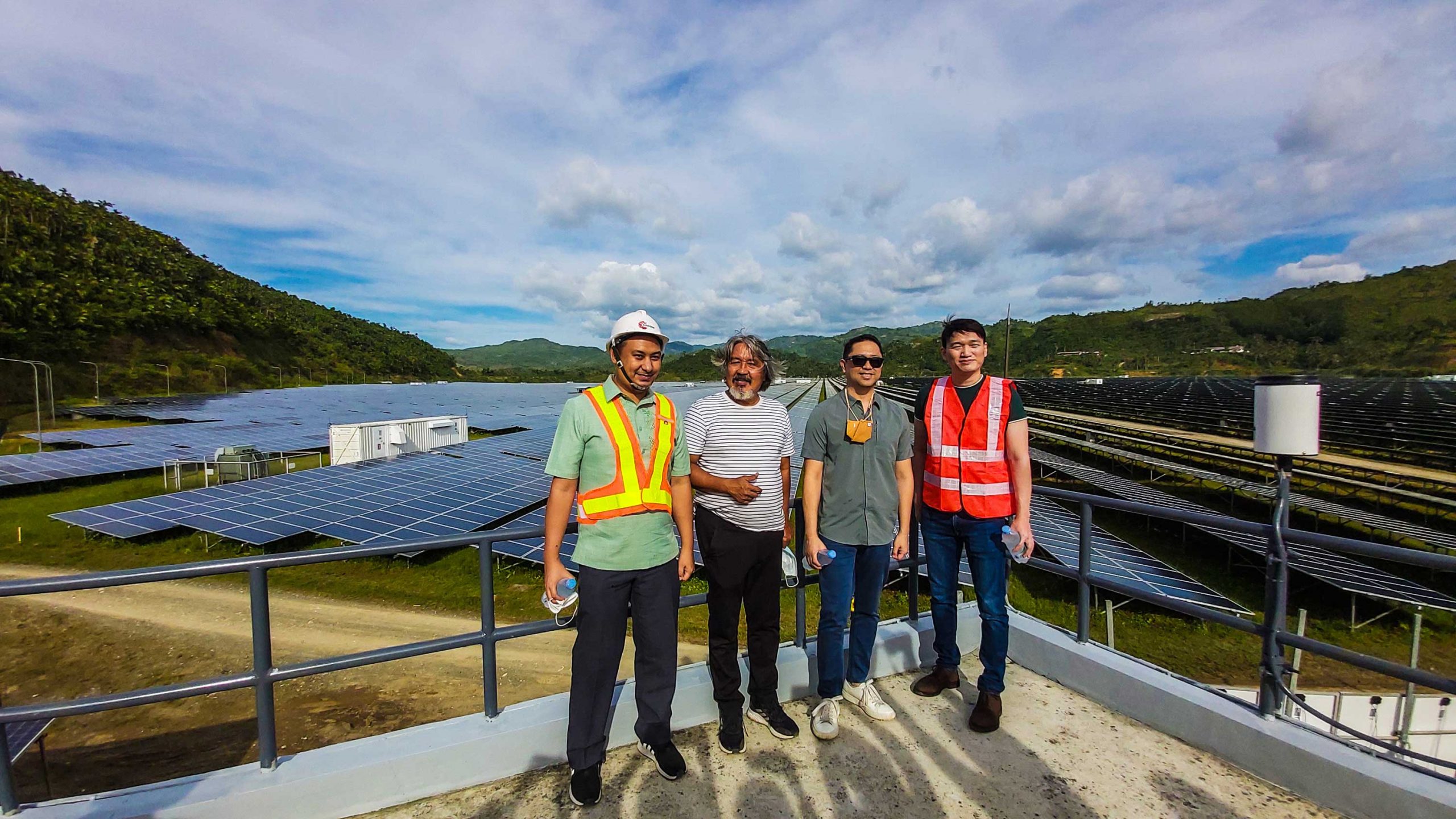 RENEWABLE ENERGY. Megawide executive director for infrastructure development Manuel Louie B. Ferrer (2nd from right) and Citicore Solar Cebu, Inc. President and CEO Oliver Tan (right) at the solar plant in Toledo City.