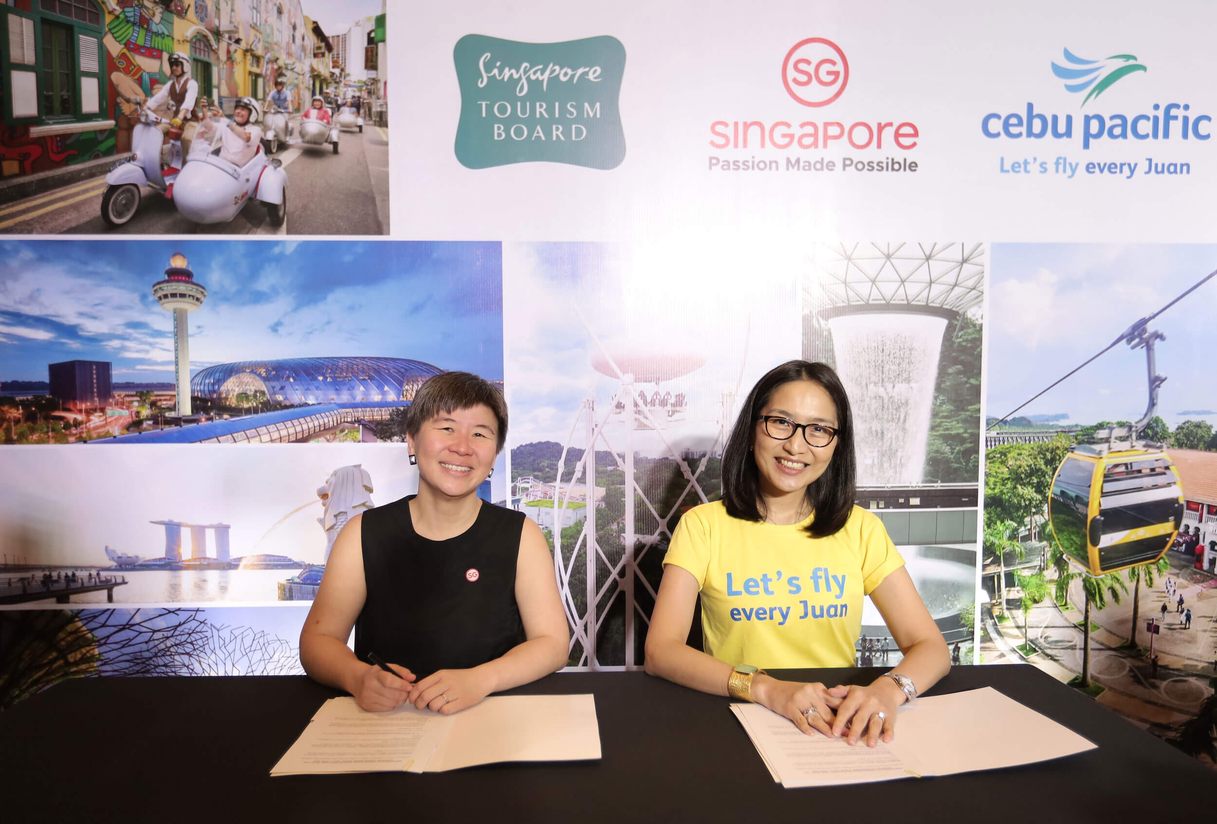 Juliana Kua and Candice Iyog formally sign the MOU between the Singapore Tourism Board and Cebu Pacific.
