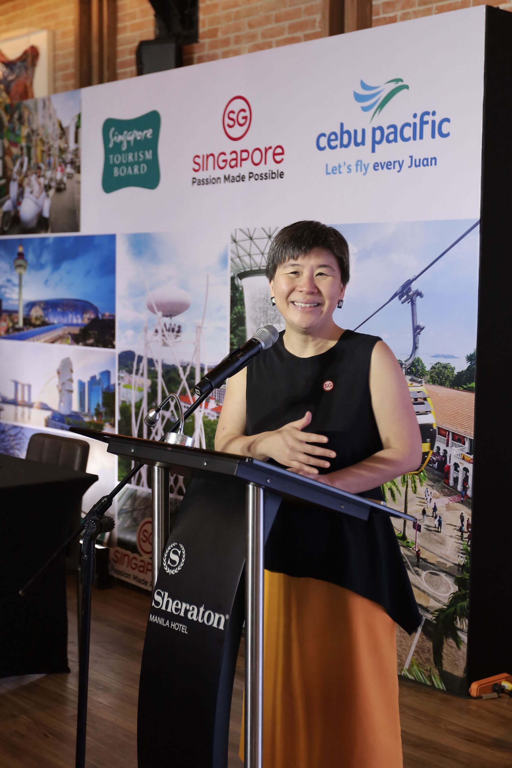 Singapore Tourism Board Assistant Chief Executive Juliana Kua welcomes guests to the Cebu Pacific and STB MOU signing.